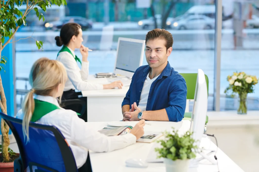young-man-listening-bank-manager
